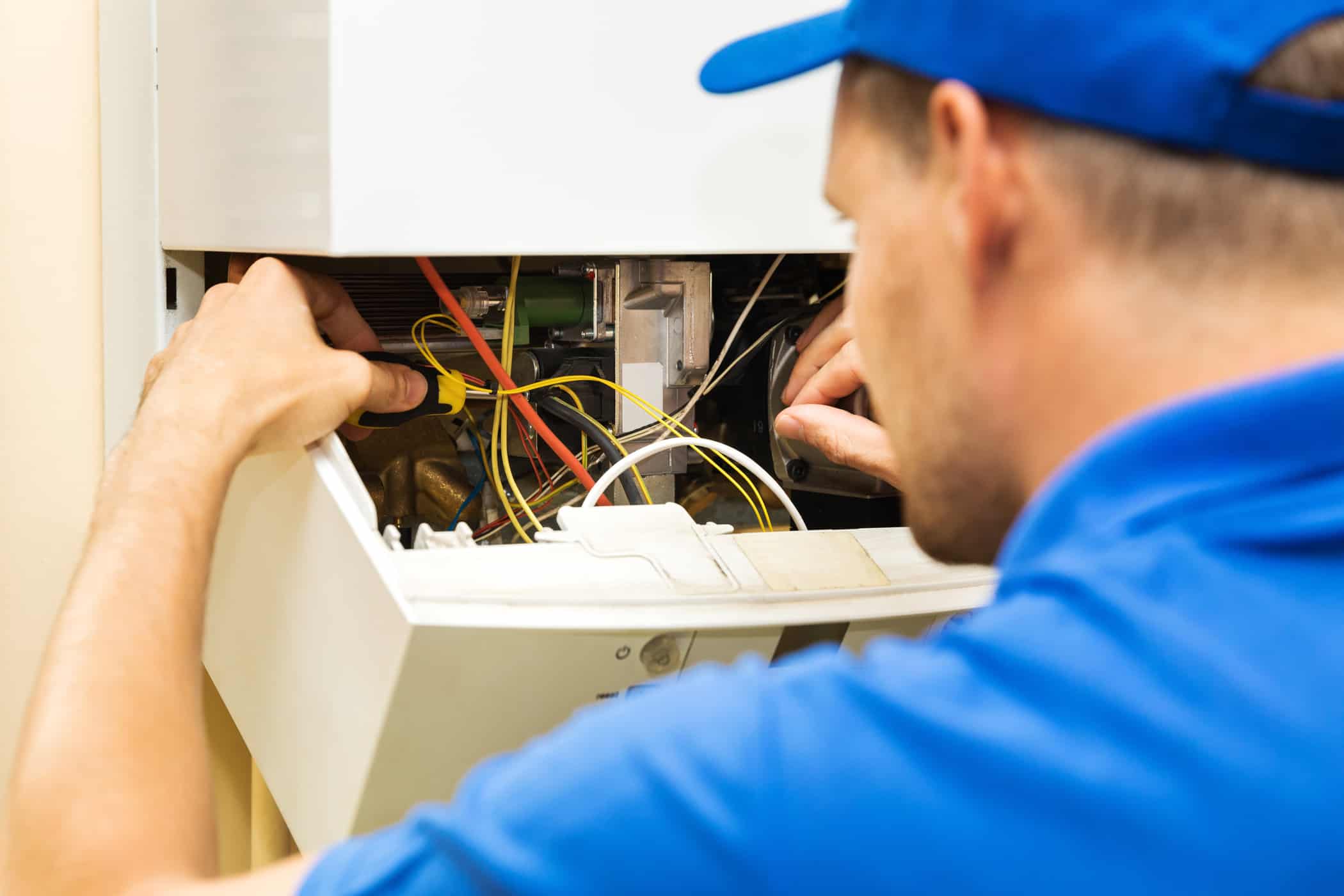 maintenance service engineer working with home gas water heater